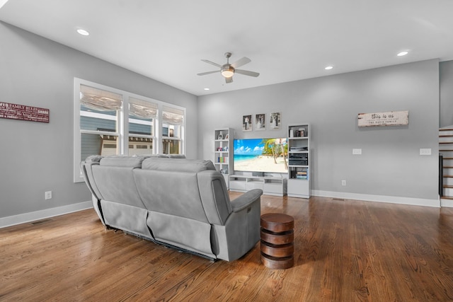 living room featuring recessed lighting, wood finished floors, a ceiling fan, and baseboards