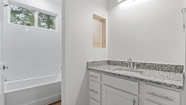 bathroom with hardwood / wood-style floors and vanity