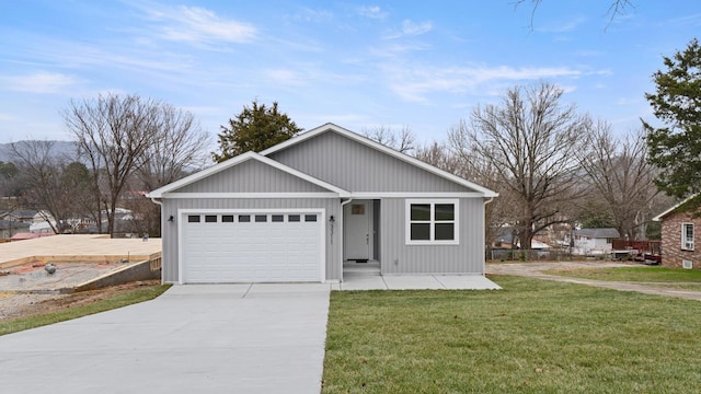 view of front facade with a garage and a front lawn