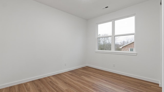 empty room with light wood-type flooring