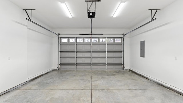 garage featuring a garage door opener and electric panel