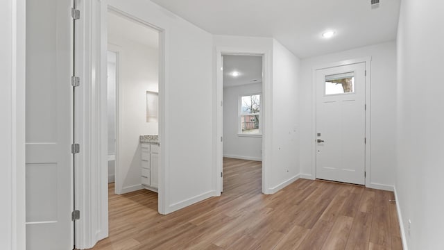 entryway with light hardwood / wood-style floors