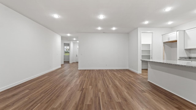 unfurnished living room with hardwood / wood-style floors