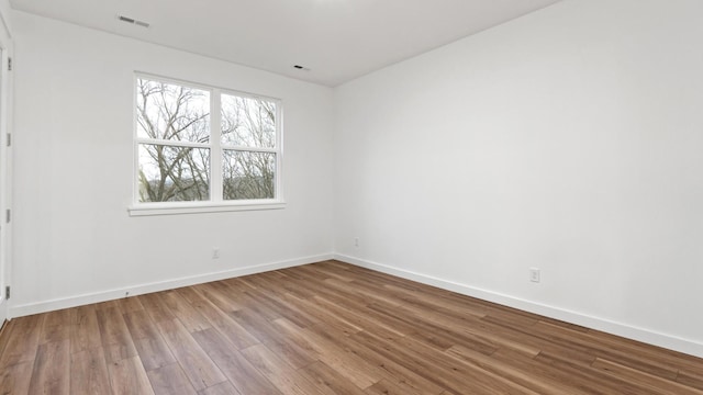 empty room featuring hardwood / wood-style floors