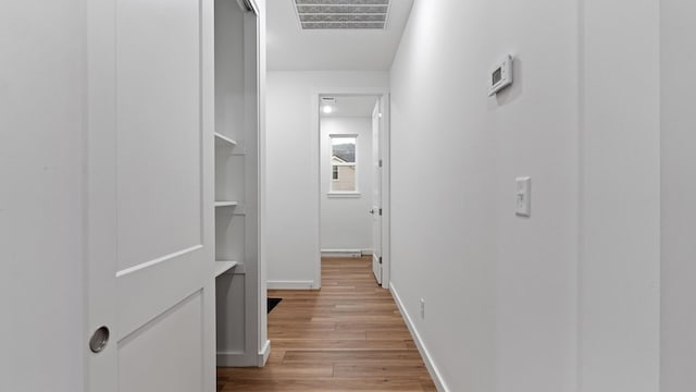 hall with light hardwood / wood-style flooring