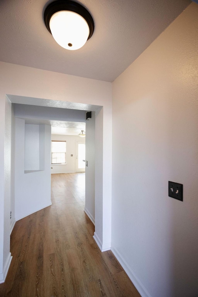 hall featuring dark wood-type flooring