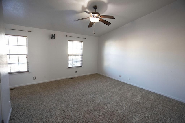 carpeted empty room featuring lofted ceiling and ceiling fan