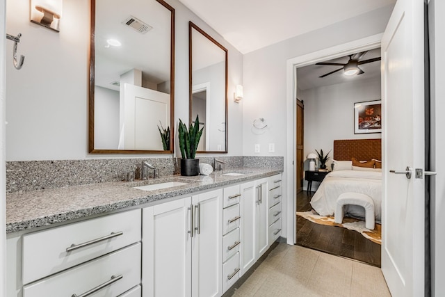 bathroom with ceiling fan and vanity