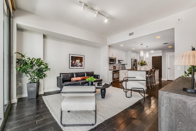 living room with dark hardwood / wood-style flooring