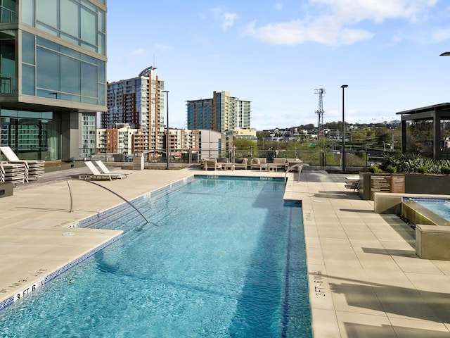 view of swimming pool featuring a patio area