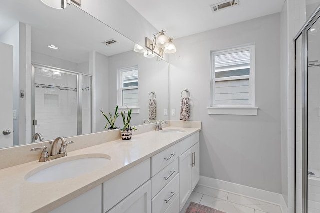 bathroom with walk in shower and vanity