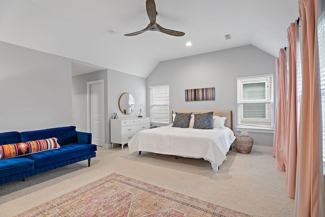 carpeted bedroom featuring ceiling fan and vaulted ceiling