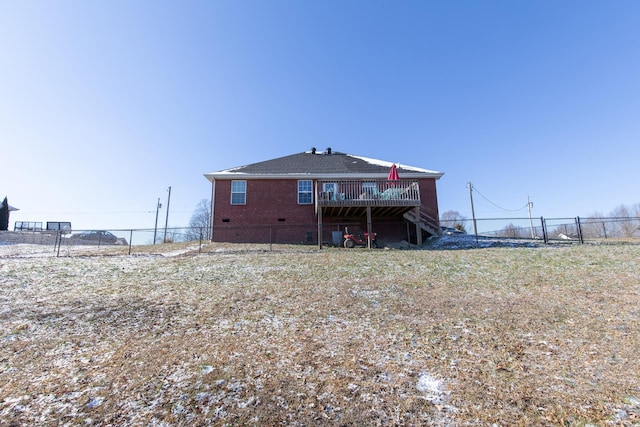 back of property featuring a deck