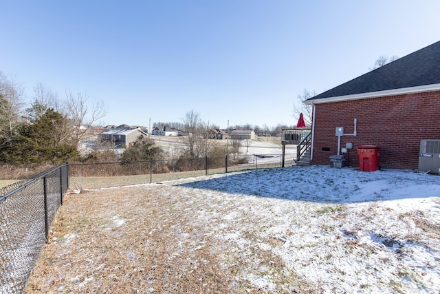 view of yard covered in snow