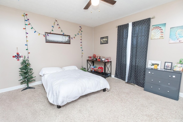 bedroom with ceiling fan and carpet