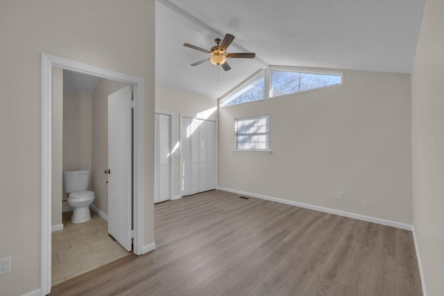 bonus room with ceiling fan, light hardwood / wood-style flooring, and lofted ceiling