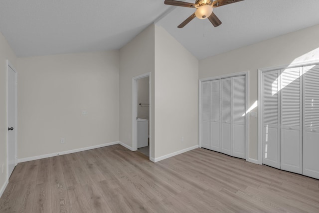 unfurnished bedroom featuring multiple closets, light hardwood / wood-style flooring, vaulted ceiling, and ceiling fan