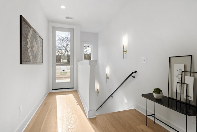 doorway to outside with light hardwood / wood-style flooring