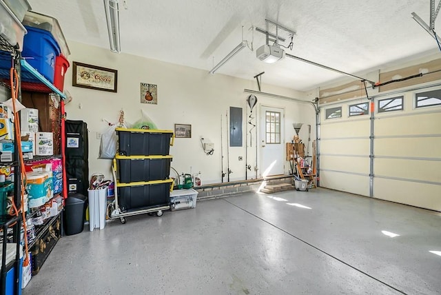 garage featuring a garage door opener and electric panel