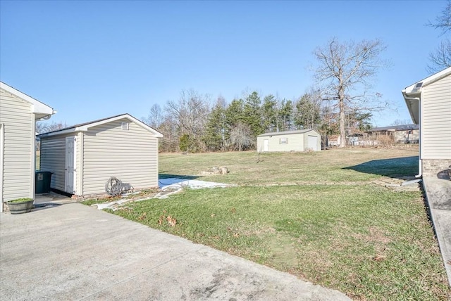 view of yard with a patio area and a storage shed