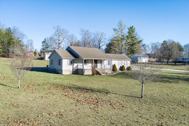 view of front of property with a porch and a front lawn