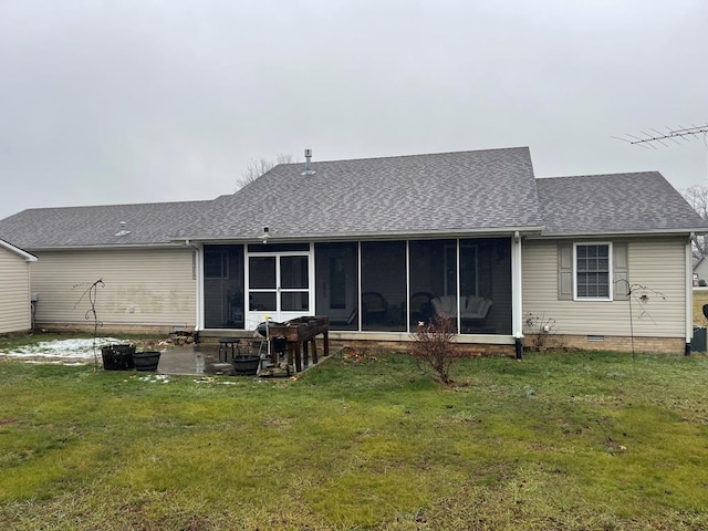 back of house featuring a patio, a yard, and a sunroom