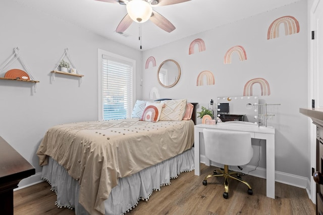 bedroom featuring hardwood / wood-style flooring and ceiling fan