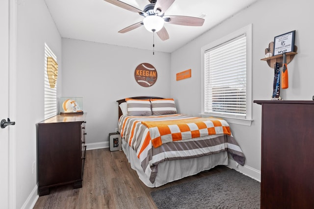 bedroom featuring dark hardwood / wood-style floors and ceiling fan