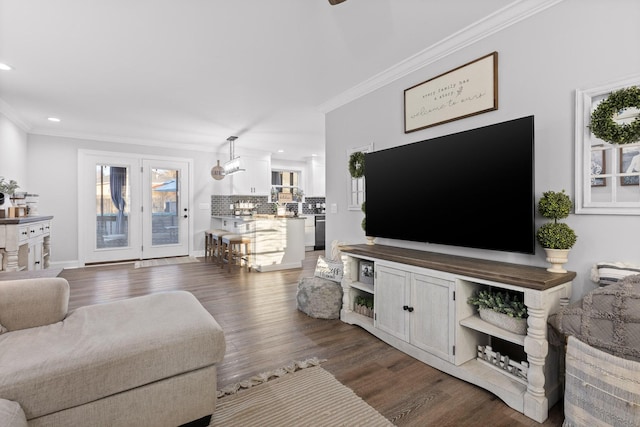 living room with crown molding and dark hardwood / wood-style floors