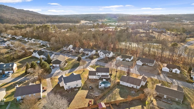 birds eye view of property with a mountain view