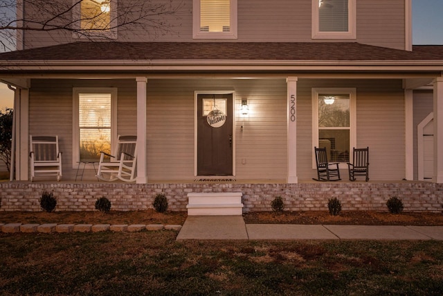 doorway to property with a porch