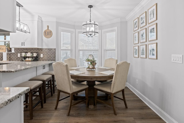 dining space with a chandelier, crown molding, and dark hardwood / wood-style floors