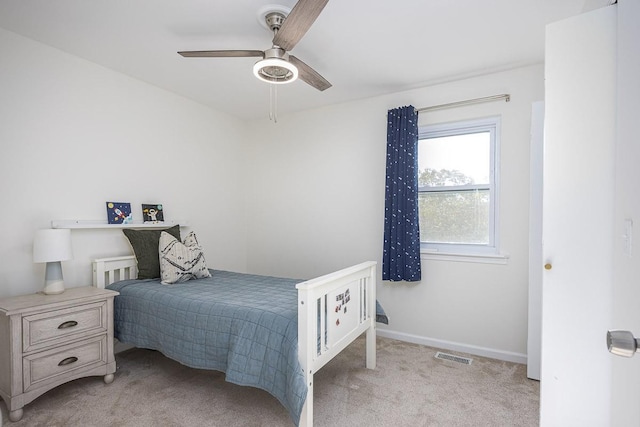 carpeted bedroom with ceiling fan