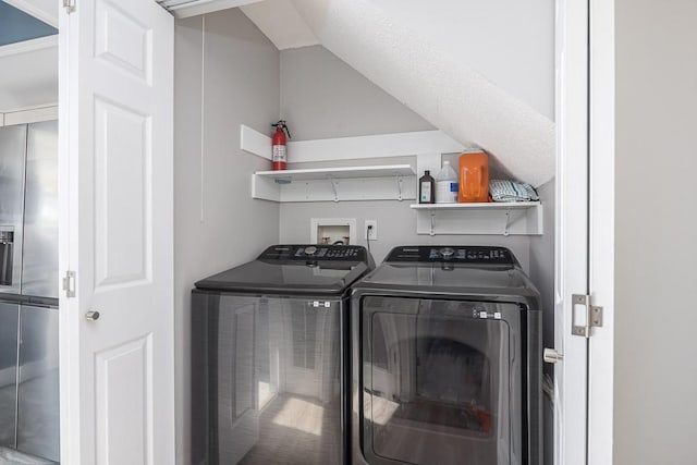 laundry area with independent washer and dryer