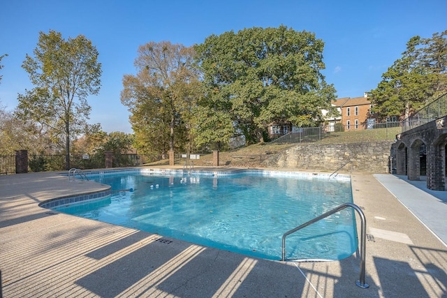 view of swimming pool featuring a patio