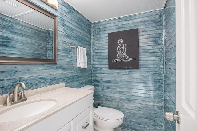 bathroom with toilet and vanity