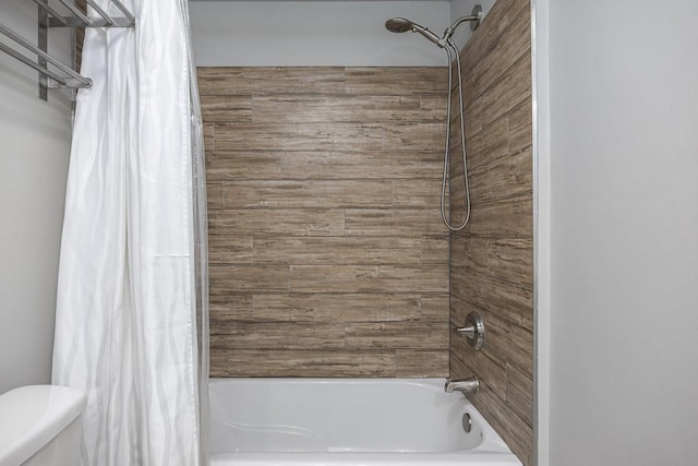 bathroom featuring toilet and shower / bathtub combination with curtain