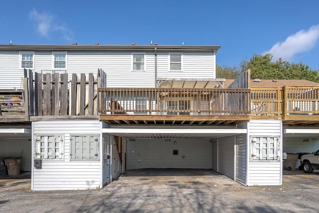 rear view of house with a wooden deck