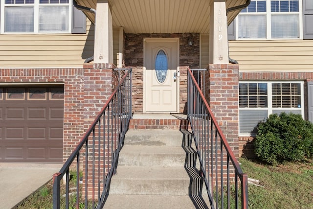 entrance to property featuring a garage