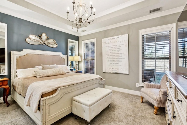 bedroom with an inviting chandelier, light carpet, and a tray ceiling