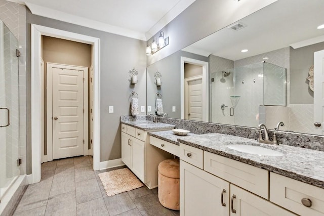 bathroom featuring an enclosed shower and vanity