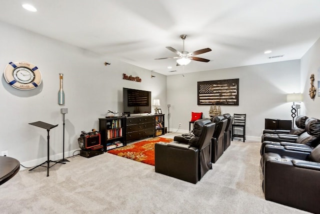 living room featuring light colored carpet and ceiling fan