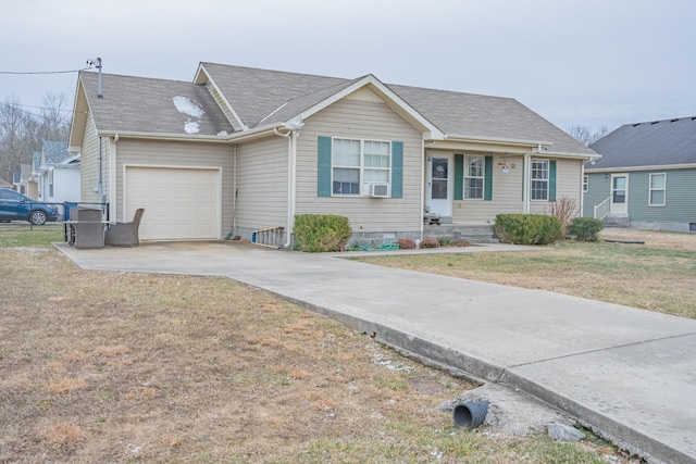 single story home featuring a garage, cooling unit, and a front lawn