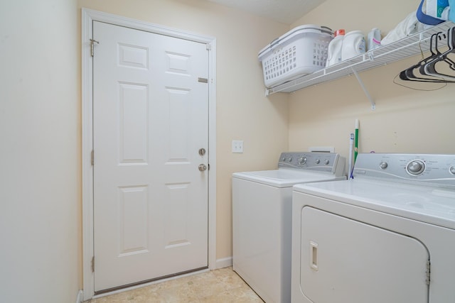 laundry room with washer and dryer