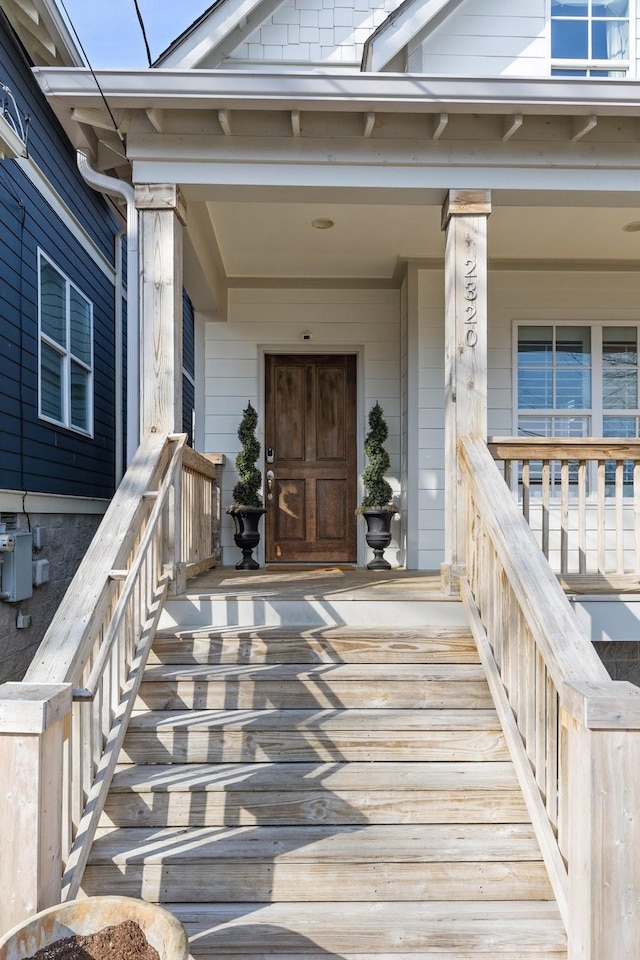 entrance to property featuring a porch