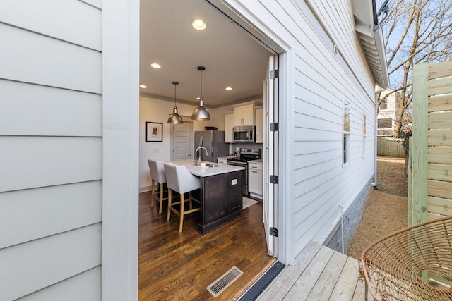 doorway to property with sink