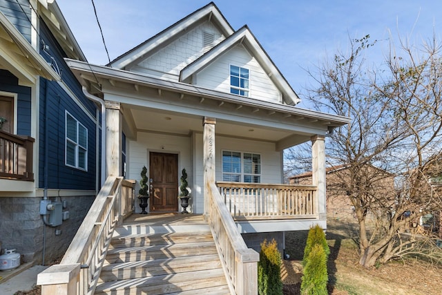 property entrance featuring covered porch