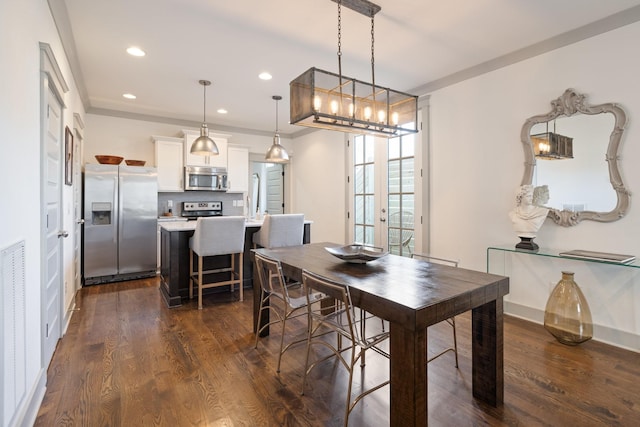 dining room featuring dark wood-type flooring and french doors