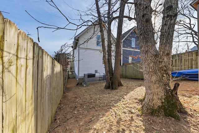 view of side of home with central air condition unit