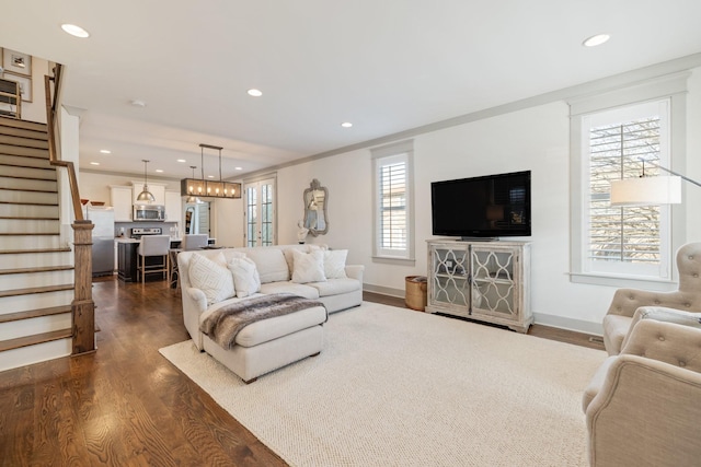 living room with dark hardwood / wood-style flooring